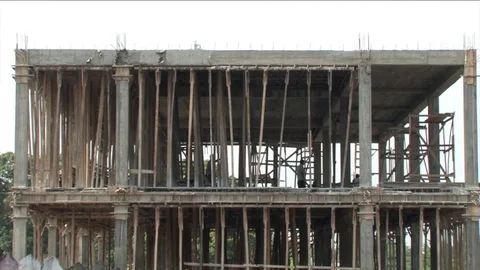 Building workers behind beams Stock Footage 80492577