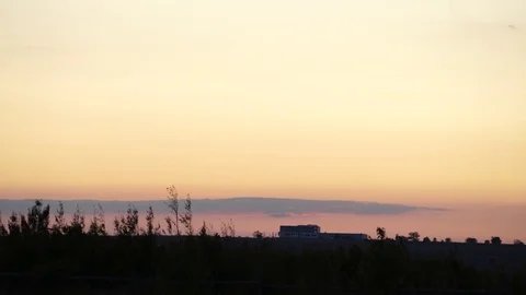 Buildings and Fields at Sunset Handheld 4K Stock Footage 82170373