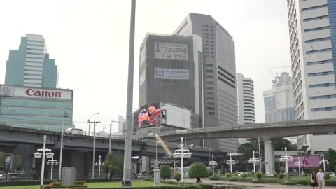 Buildings and overpass intersection near Lumphini park in Bangkok Stock Footage 290452009