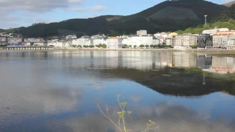 Buildings and sky reflected in river Landro in Viveiro, Spain Stock Footage 249361052