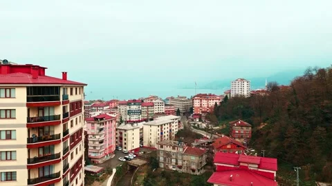 Buildings in a city with a mountain in the background Stock Footage 267635579