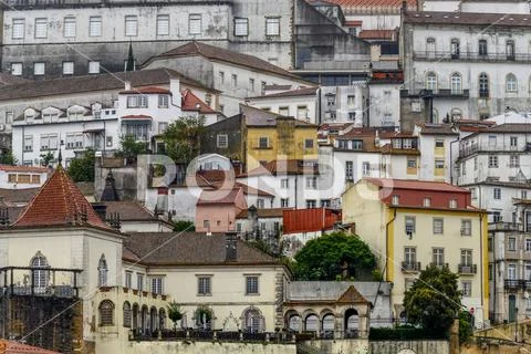 Buildings crowded together on a hillside; Coimbra, Portugal Stock Photos