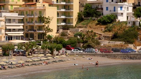 BUILDINGS EASTERN BAY BEACH AGIOS NIKOLAOS CRETE Stock Footage 70703389