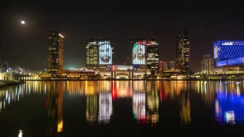 Buildings lit up with face of Sheikh Zayed for UAE National Day in Abu Video stock 145415947