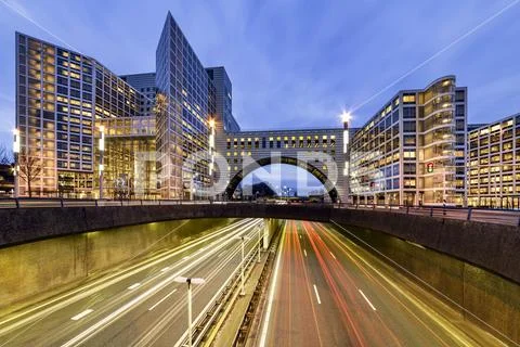 Buildings over the end of A12 highway entering inside The Hague city during t Stock Photos