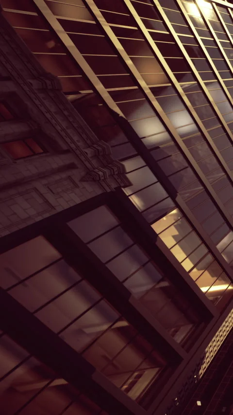 Buildings reflect light during sunset in an urban setting Stock Footage 334247818