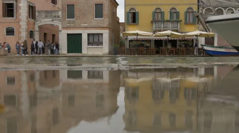 Buildings reflected in a puddle of water in Venice Stock Footage 59851300
