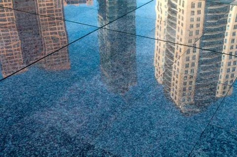 Buildings reflection in street Stock-Fotos