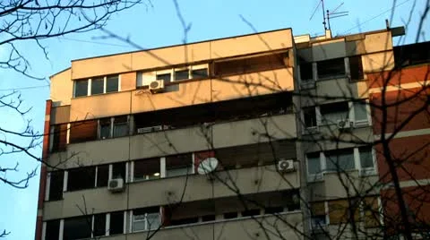 Buildings at sunset behind tree 3 Stock Footage 10711556