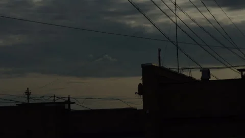 Buildings at sunset, dramatic sky with clouds Video stock 311045115