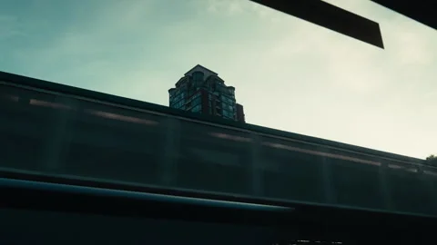 Buildings through the window of a train Stock Footage 244542481