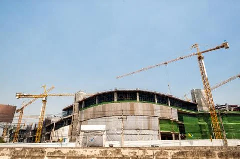 Buildings under construction with cranes Stock Photos