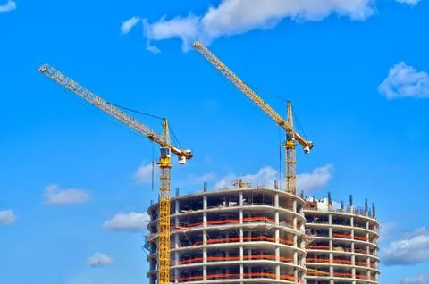 Buildings under construction with cranes Photos