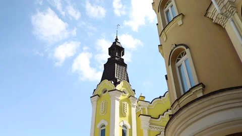Buildings with yellow Wall and Triangular Roof over cyan sky Stock Footage 197330003
