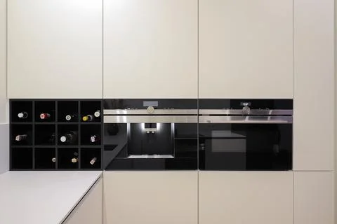 Built-in automatic coffee machine, electric oven in the kitchen furniture Stockfoto's