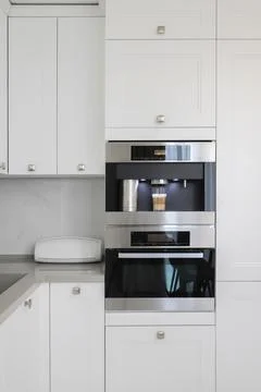 Built-in automatic coffee machine in kitchen furniture Foto stock