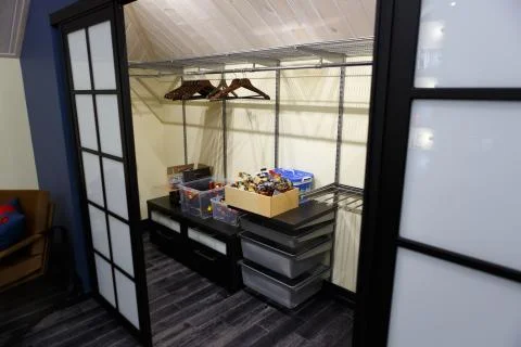 Built-in closet for things. Large square doors. Stock Photos
