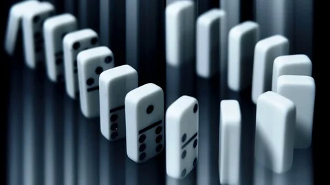 Built figure of dominoes falling in slow motion Stock Footage 72632283