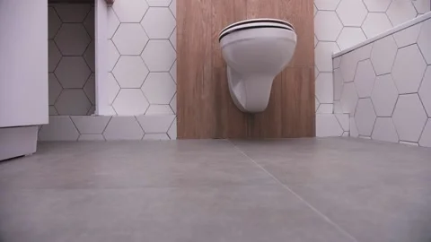 Built-in toilet in the bathroom, hexagonal ceramic tiles Stock Footage 160133096