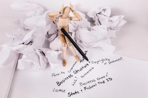 Buisness structure help jointed doll hands on head overwhiled Stock Photos