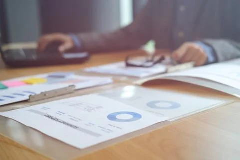 Buisnessman working with computer &amp; document at workplace Stock Photos