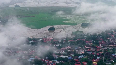 Bukit Mertajam cloudy day over rice fields and village 動画素材 332186586