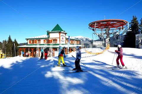 BUKOVEL, UKRAINE - FEBRUARY 17: The cableway, skiers and restaurant in Bukove Stock Photos