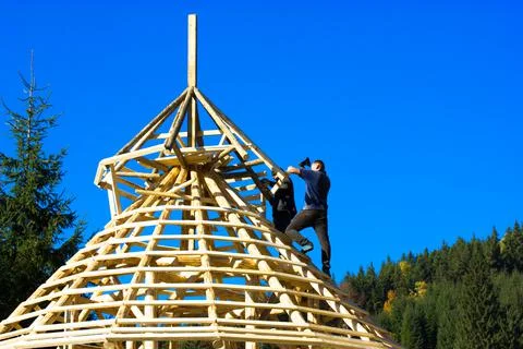 Bukovel, Ukraine. October 1, 2021. Construction a roof with woods. Builder, axe Stock Photos