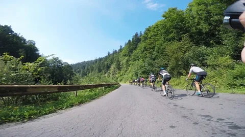 Bukovel/Ukraine - August 8, 2018 - Group of professional cyclist hard training Stock Footage 119339757