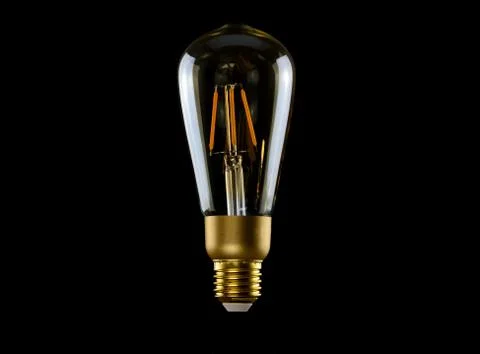 The bulb on black background Stock Photos