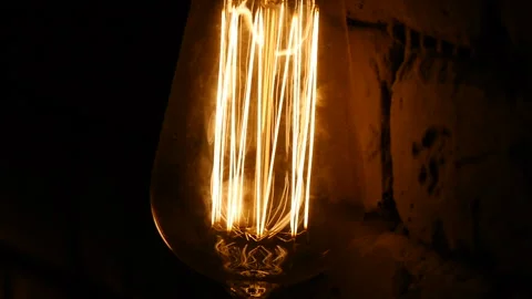 Bulb close-up. The light flashes. Vintage lighting decoration. Classic edison Stock Footage 106998738