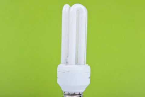 Bulb on green background Stock Photos