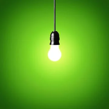 Bulb on green background.idea concept. Stock Photos