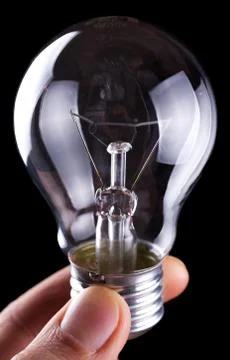 Bulb in hand Stock Photos