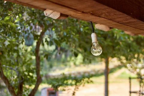 Bulb hangs from the cabin ceiling Stock Photos