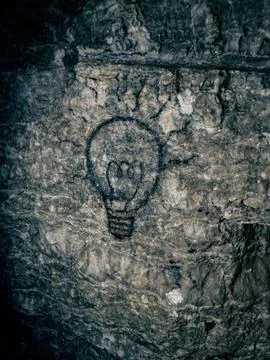 Bulb on rock in the cave Foto stock