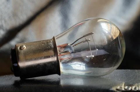 A bulb on table Stock Photos