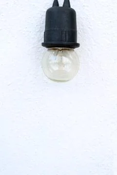 Bulb on white wall background Foto stock