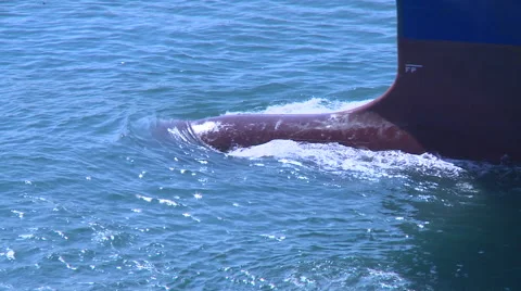 Bulbous bow of a cargo ship in ocean. Bulb modifies the way the water flows Stock Footage 66454549