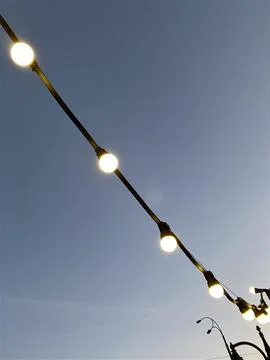 BULBS ON THE BACKGROUND OF THE SKY Stock Photos