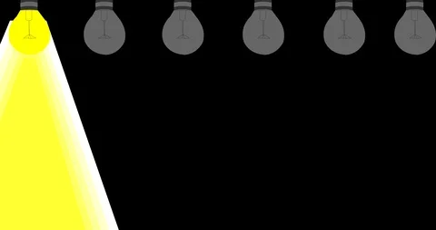 The bulbs light up randomly with letters on a black background Inscription: Idea Stock Footage 124360485