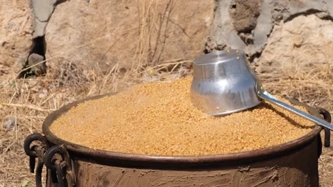 Bulgur is cooking in cauldrons 2 Stock Footage 294037594