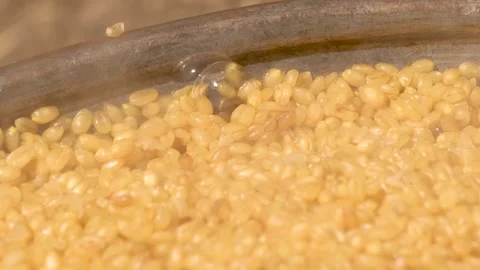 Bulgur is cooking in cauldrons 4 Stock Footage 294037553