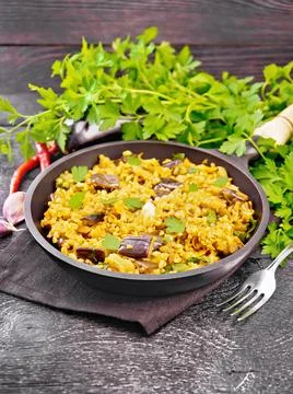Bulgur with eggplant in pan on table Foto stock