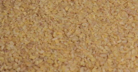 Bulgur grains rotating close up Stock Footage 99813152