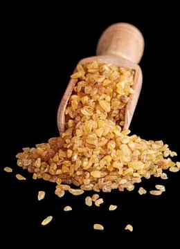 Bulgur in scoop front view Stock Photos