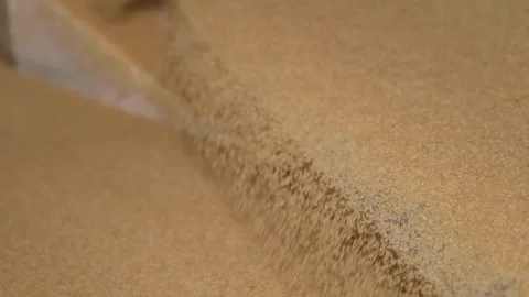 Bulgur is sifted by machine according to it's size (slow motion) 2 Stock Footage 294036536