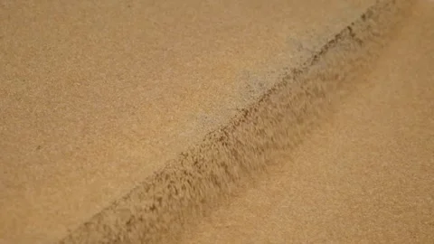 Bulgur is sifted by machine according to it's size (slow motion) 3 Stock Footage 294036612