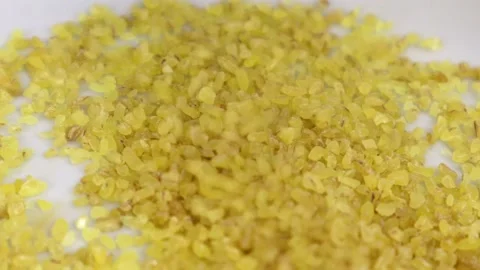 Bulgur Wheat Uncooked Falling Into a White Bowel Close-up 스톡 동영상 132664783