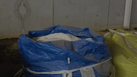 Bulk bag filled with recycled plastic pellets at processing factory Stock Footage 334281313